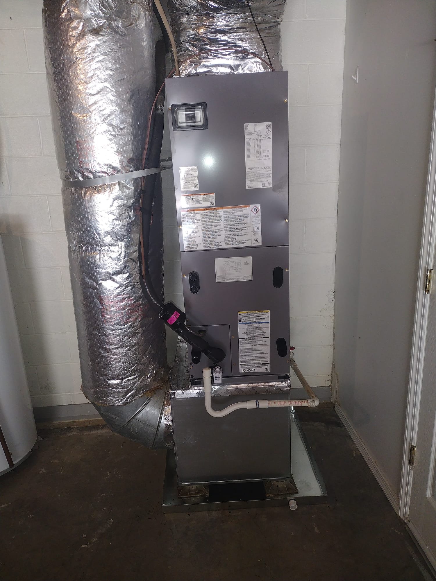 New HVAC installation demonstrating excellent setup in a utility area