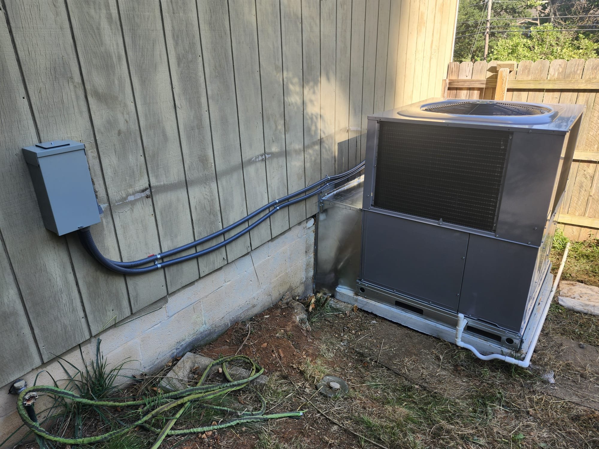Pristine HVAC installation next to a house