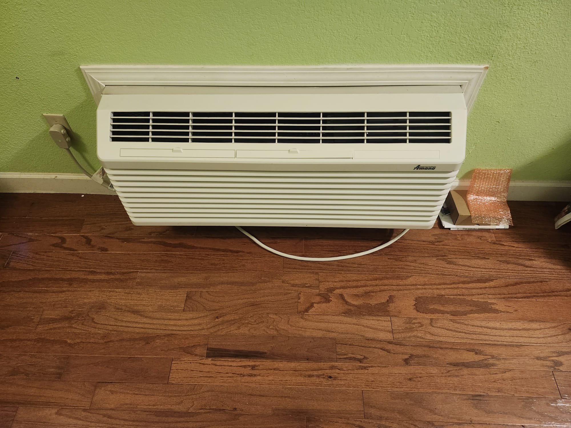 A newly installed PTAC unit in a residential setting