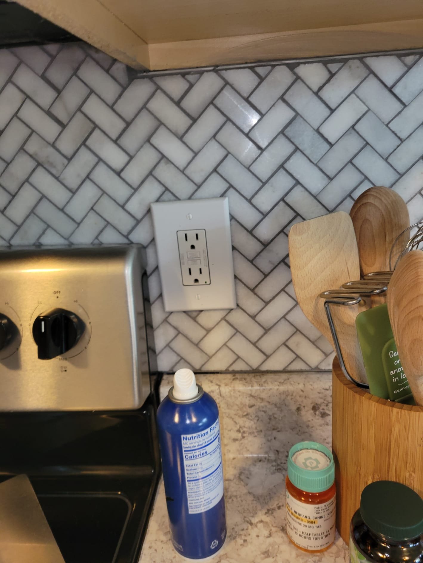 Freshly installed GFCI outlet in kitchen backsplash