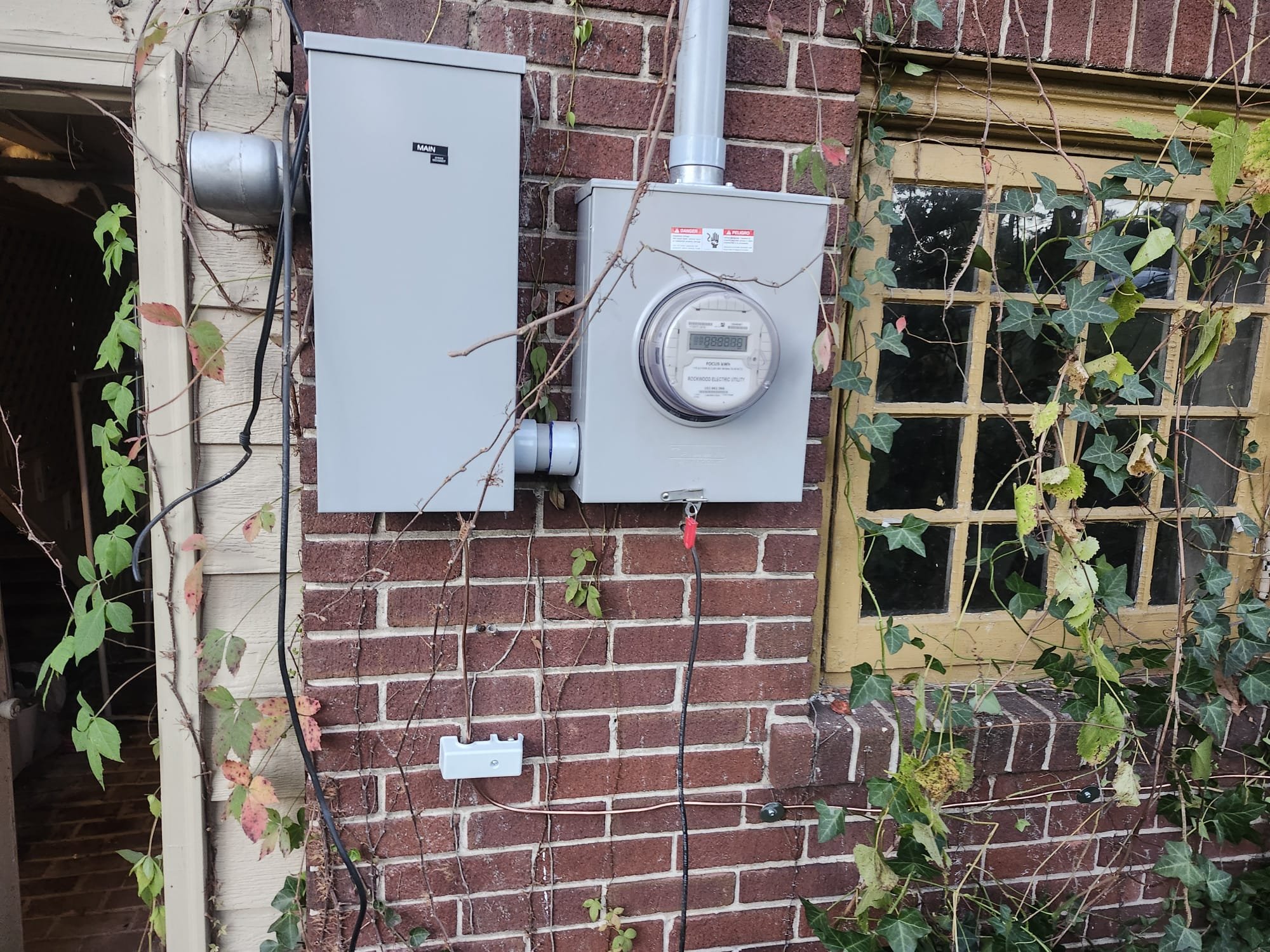 Modern 200-amp main panel and digital meter setup