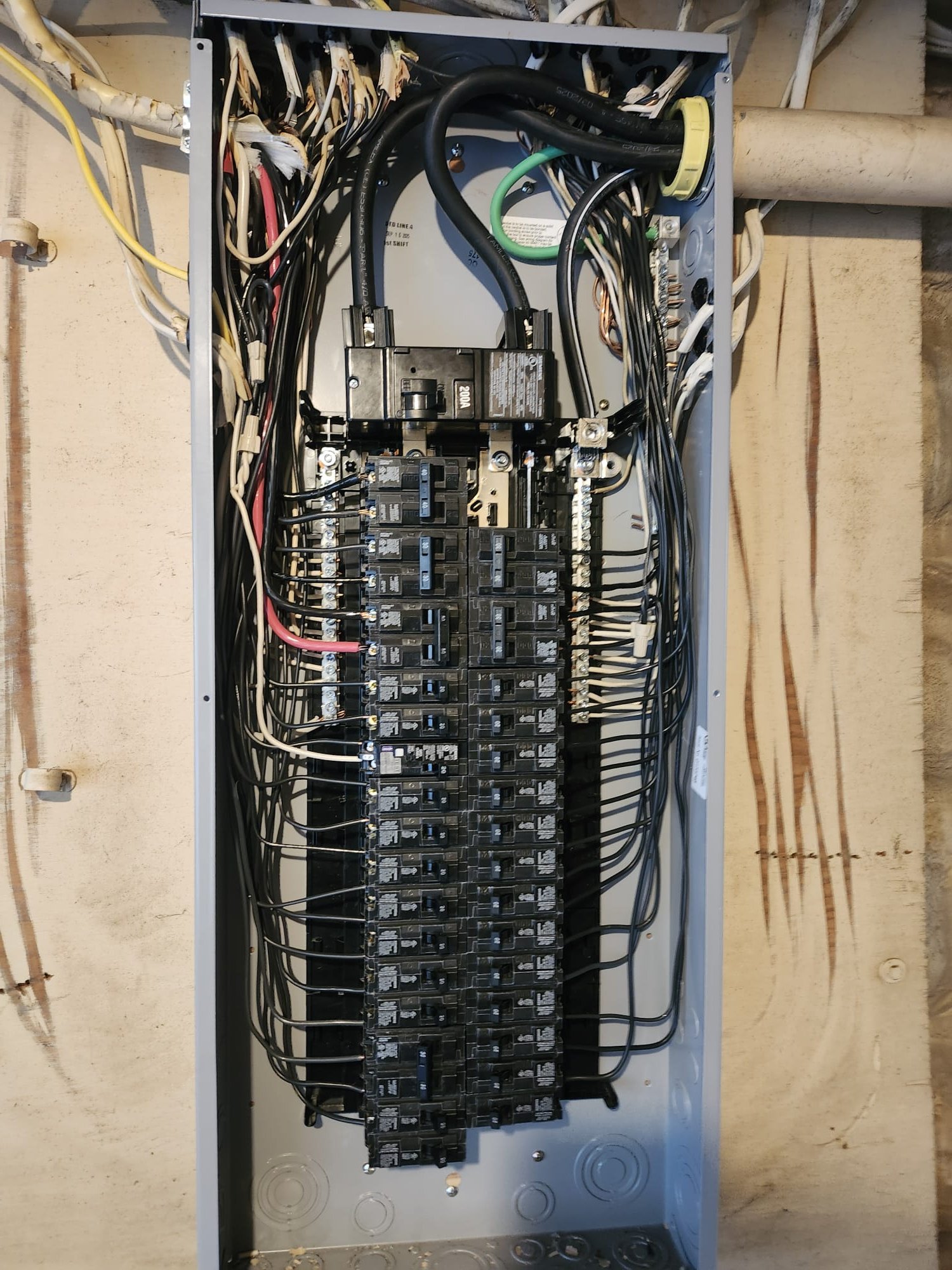 Interior view of the upgraded breaker panel with neatly arranged wires