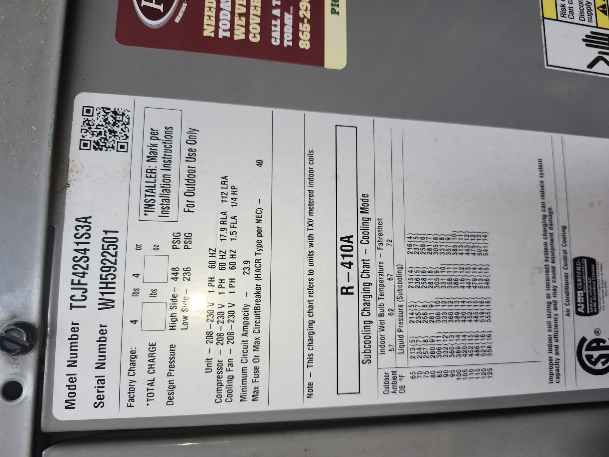 Close-up of the outdoor unit’s specification label, a key reference for ensuring correct setup and future maintenance.