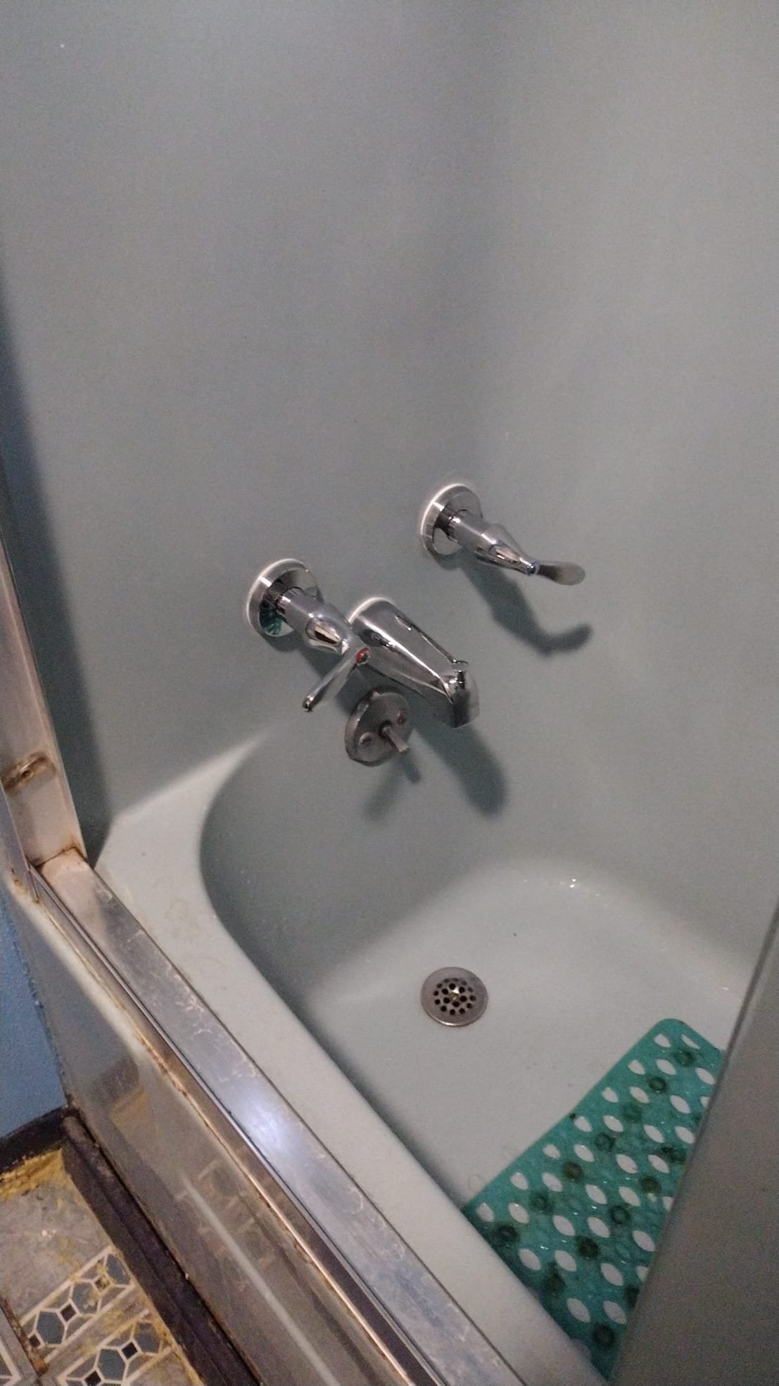 Shiny new shower handles after replacement