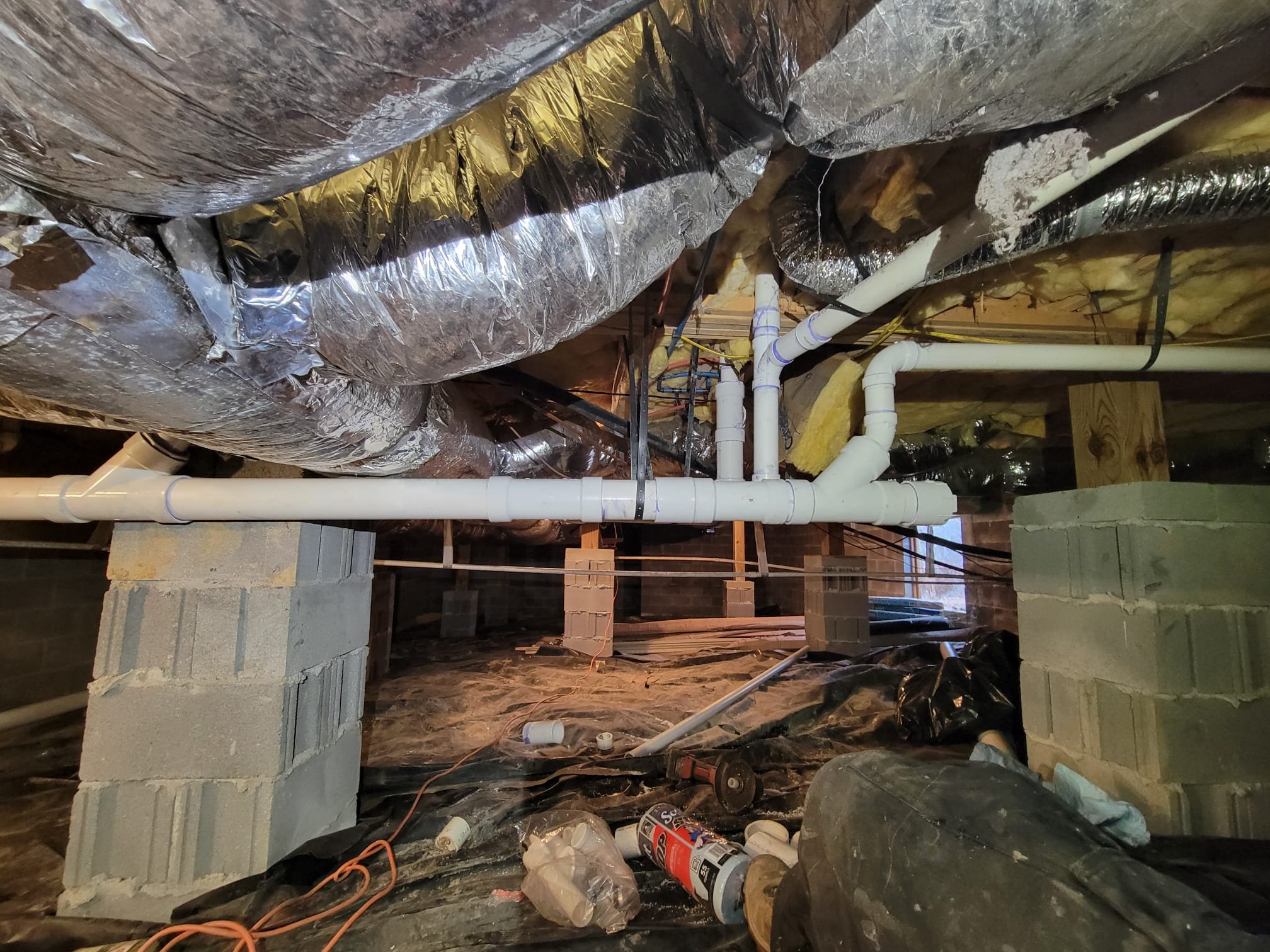Professional repipe work in a crawl space