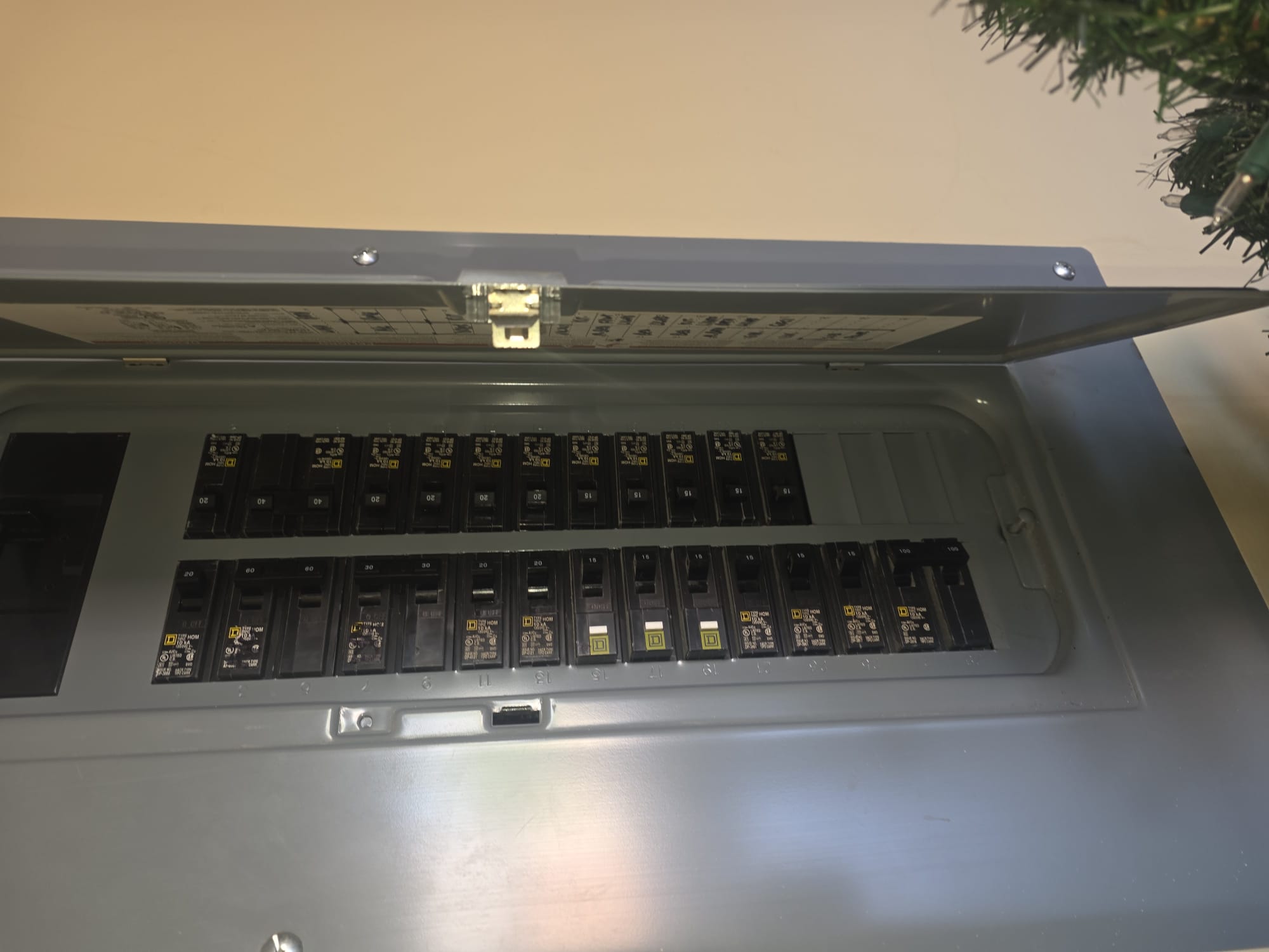 Open breaker panel with labeled switches