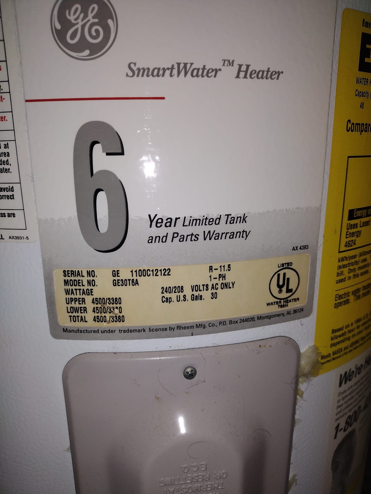 Close-up of new connections and flexible water lines on a water heater