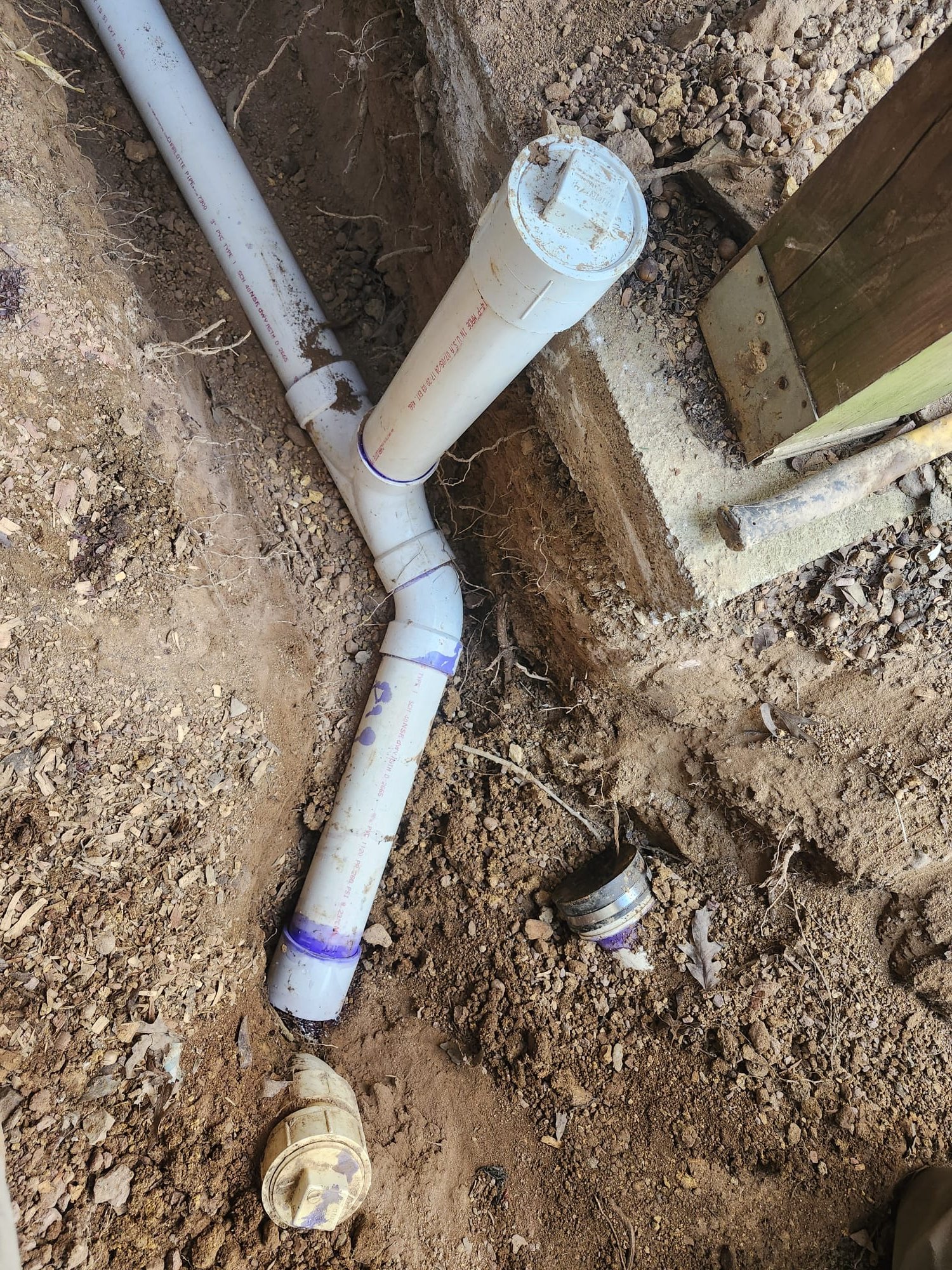 Trench showing newly glued joints with primer