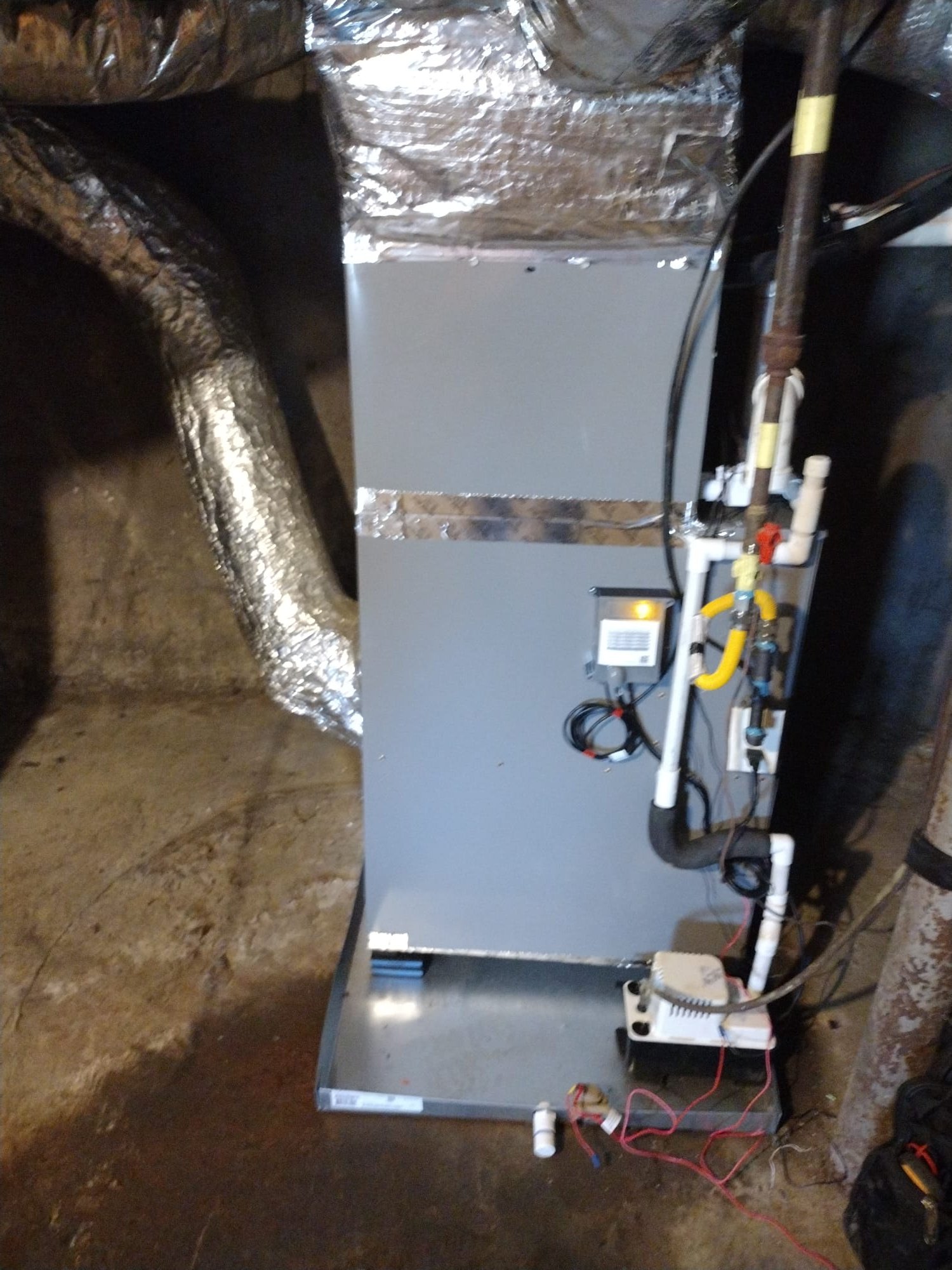 Freshly installed air handler ready for duct connections