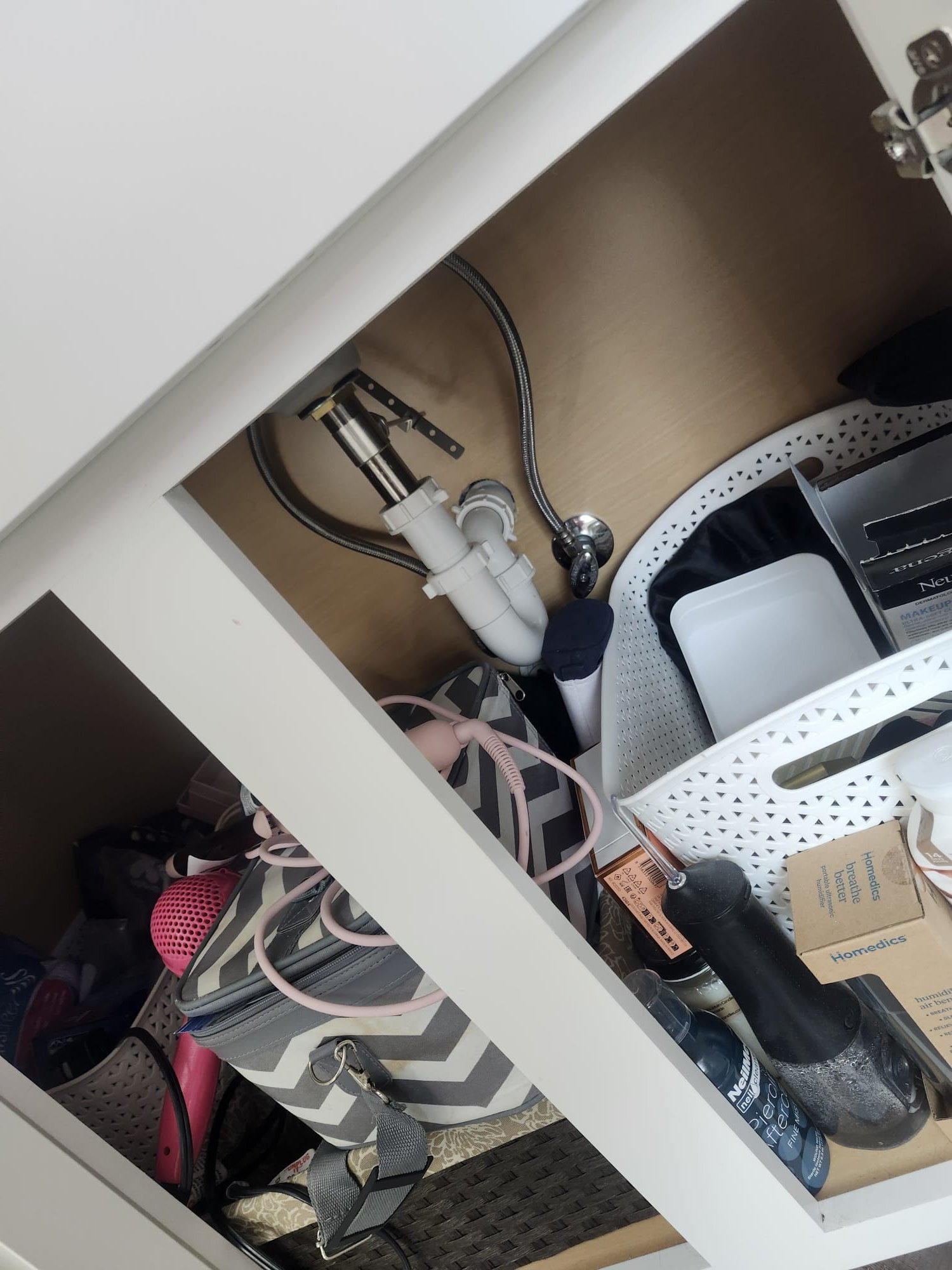 Under-sink plumbing with new pipes and braided supply lines