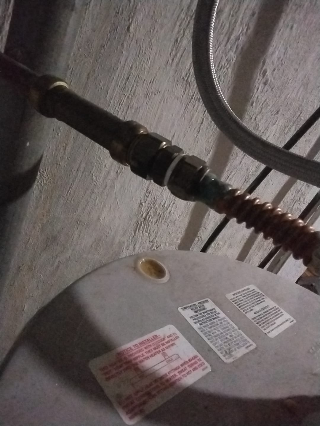 Top view of water heater fittings