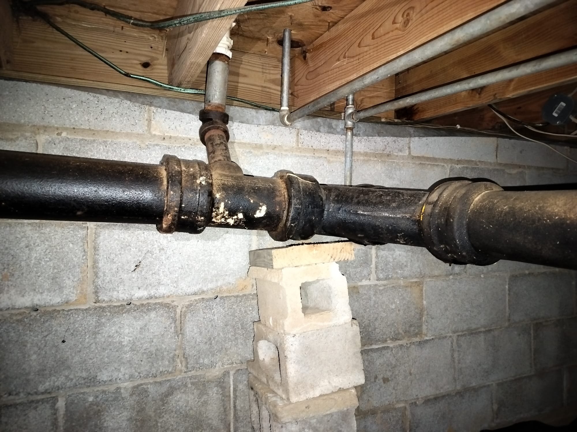 Old cast-iron pipes on makeshift support