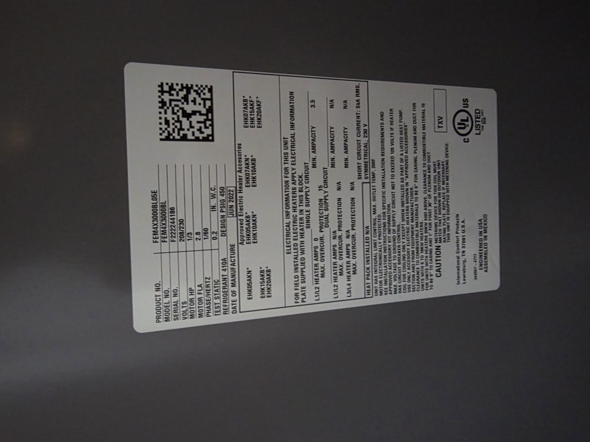 Clean, intact specification label on a new HVAC unit