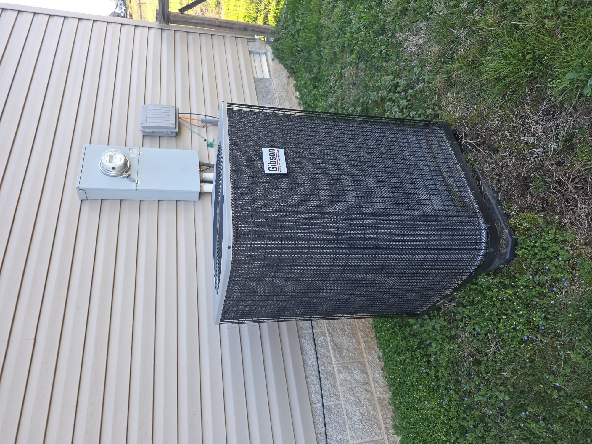 A well-maintained outdoor heat pump unit sitting level and free of debris.