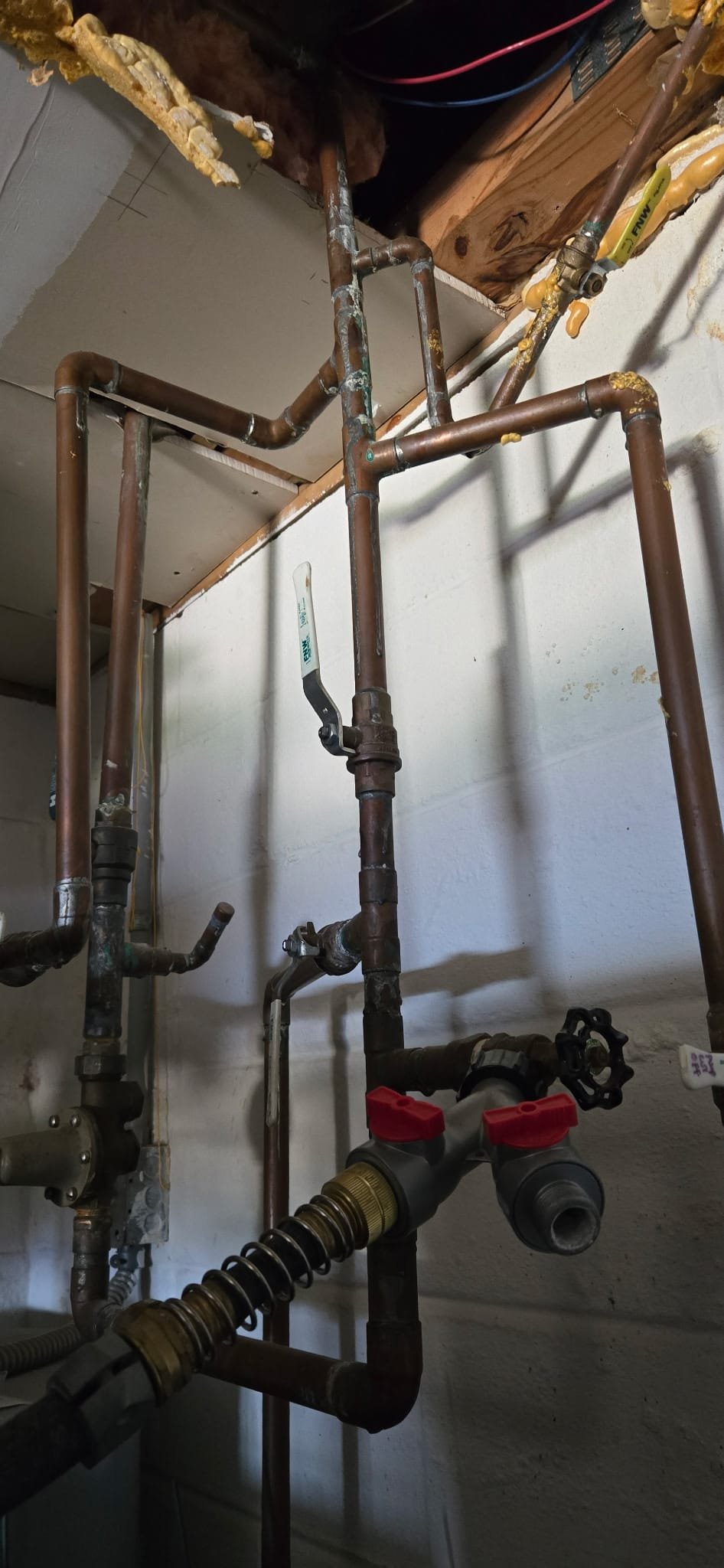 Copper Pipes and Valves in a Utility Room