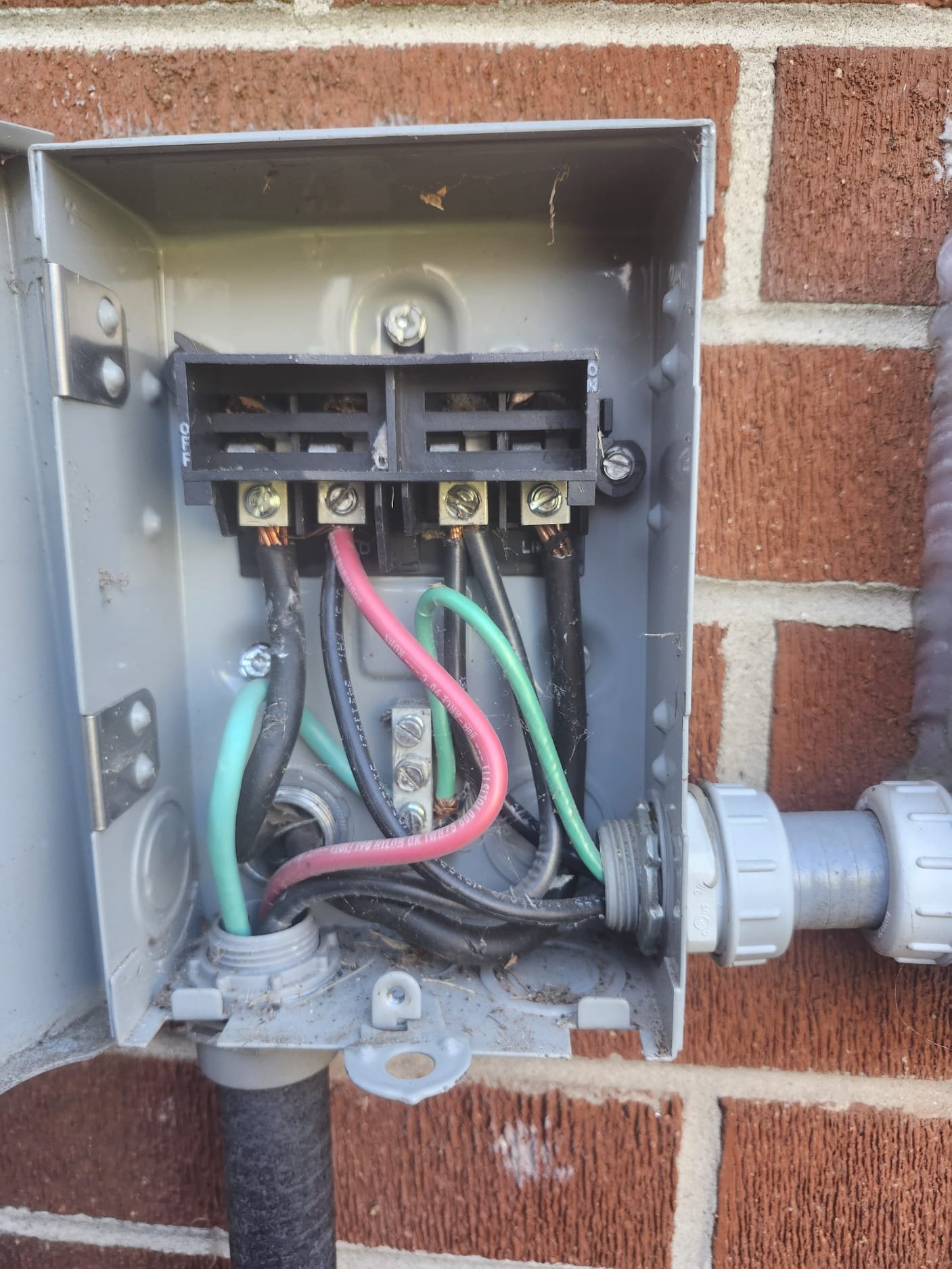 Outdoor electrical disconnect box by new HVAC unit