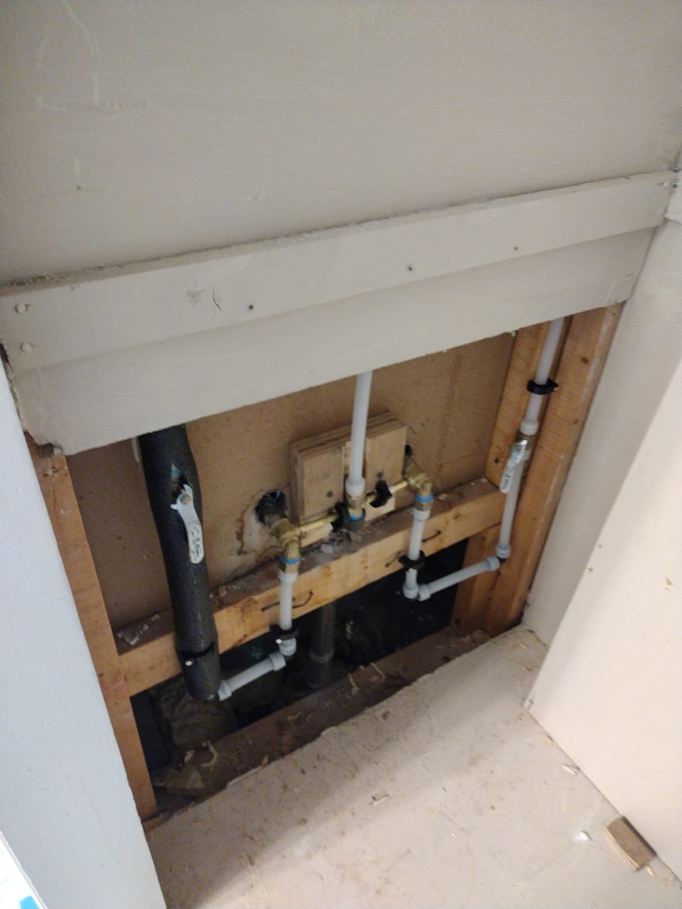 Open wall showing new PEX repipe installation