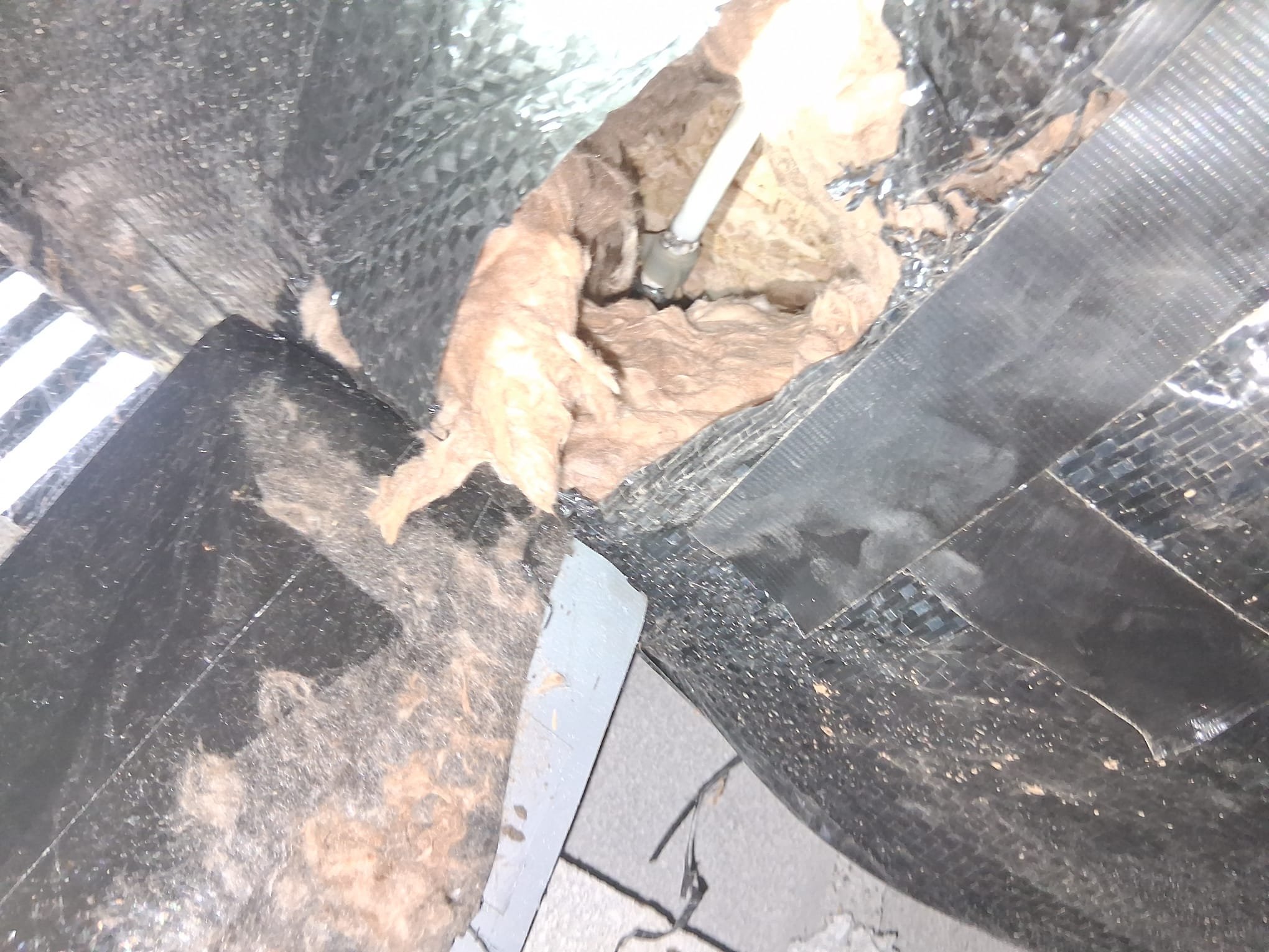 Worn Insulation Exposing Pipes