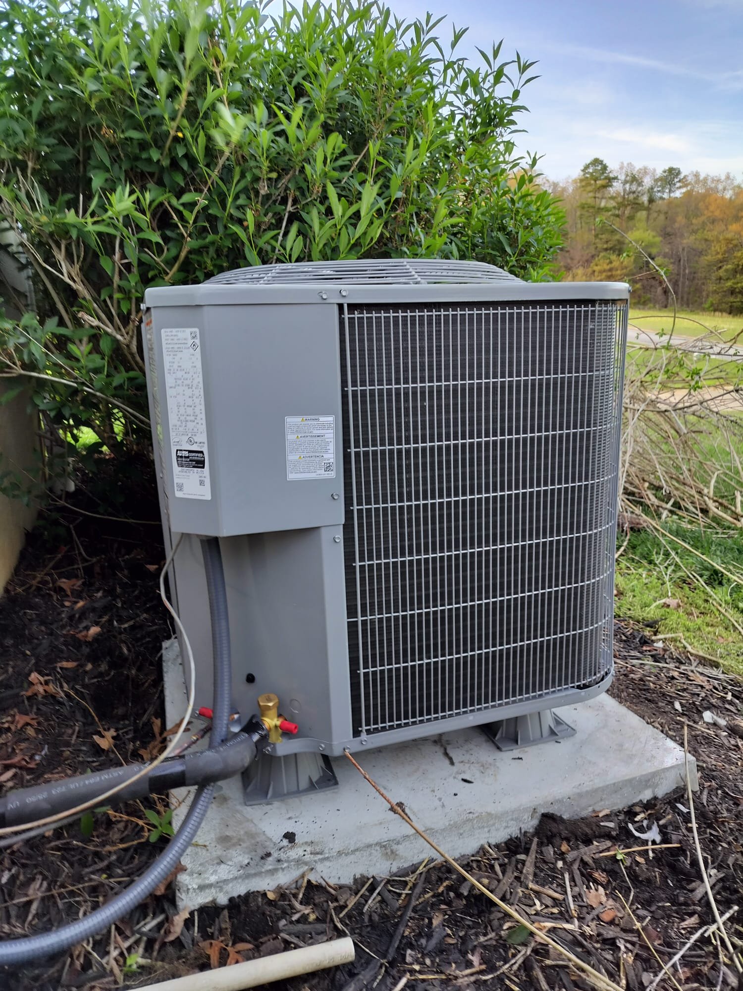 Outdoor unit mounted on new concrete pad