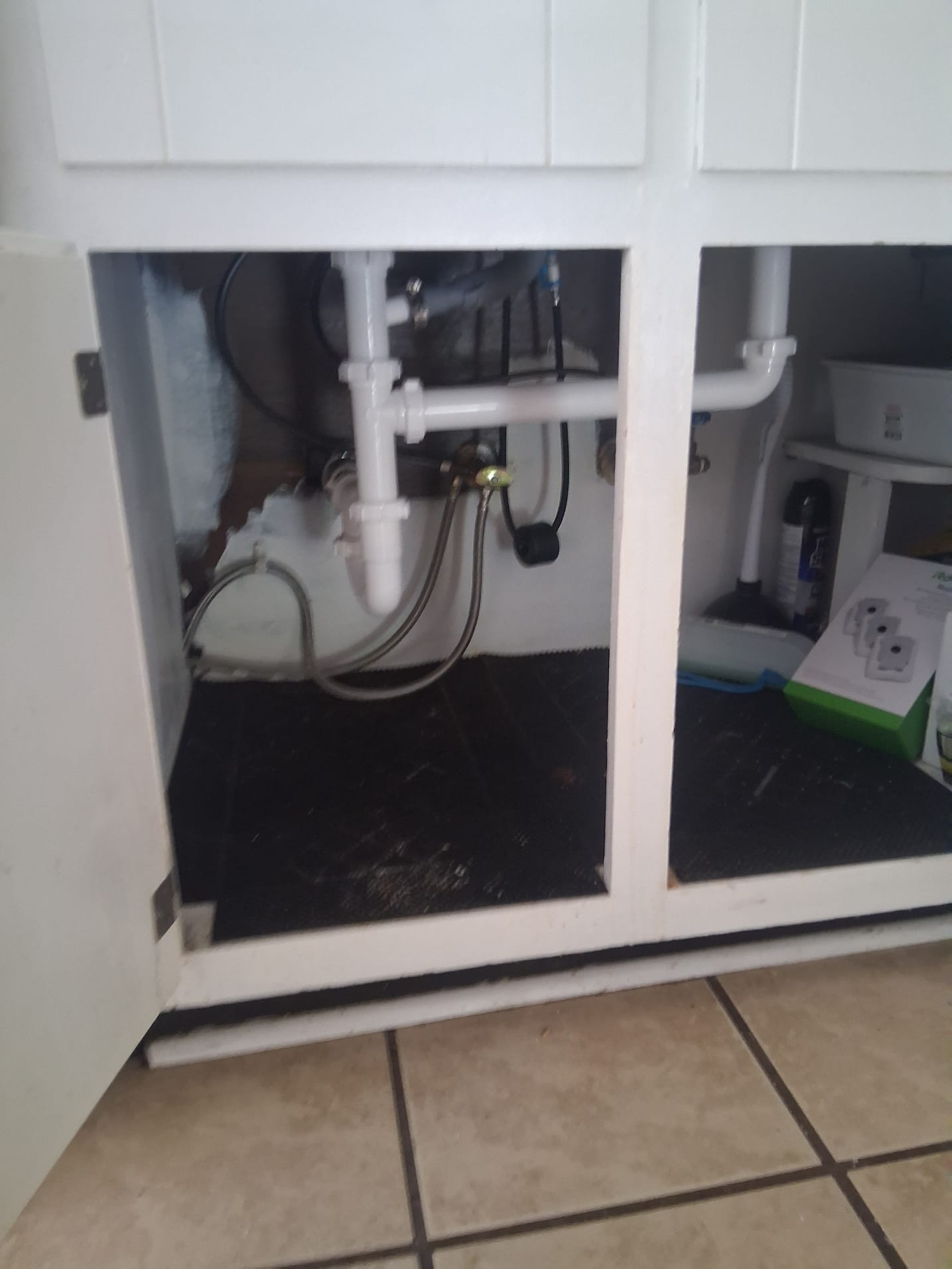 Clean under-sink plumbing with new PVC fittings