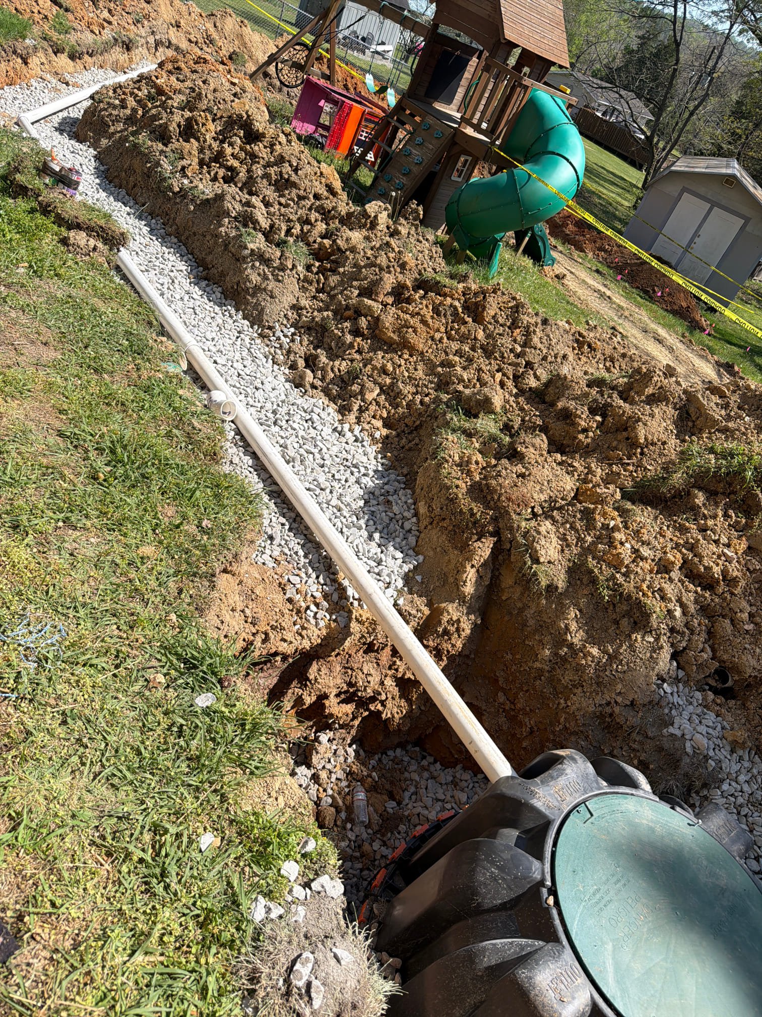 New septic tank riser with green lid and new PVC piping