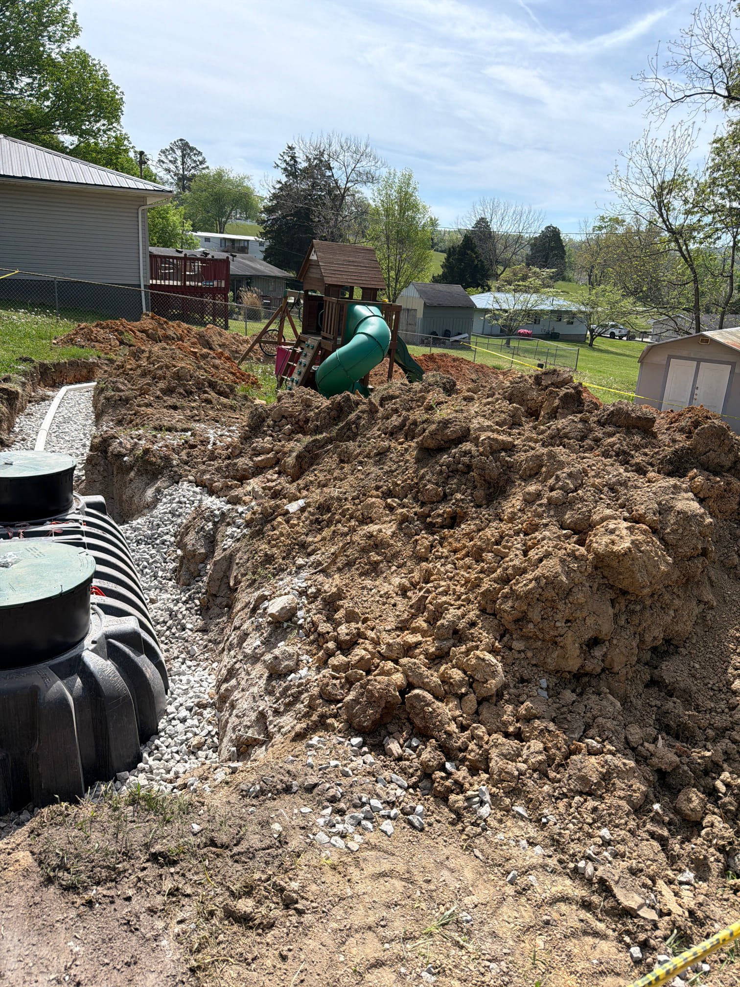 Residential backyard septic installation with new pipes and gravel