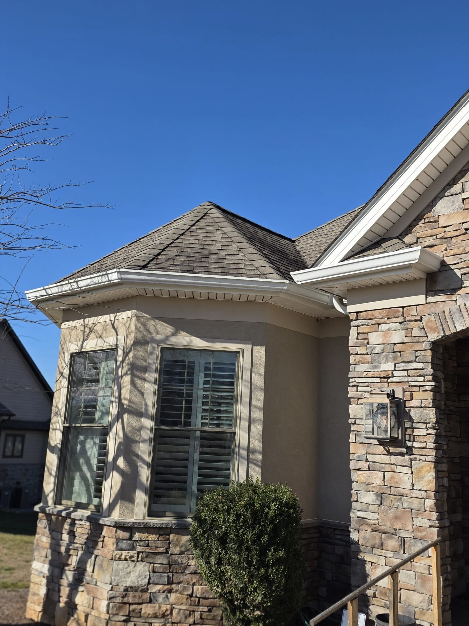 Clean roof and new gutters on a corner exposure.