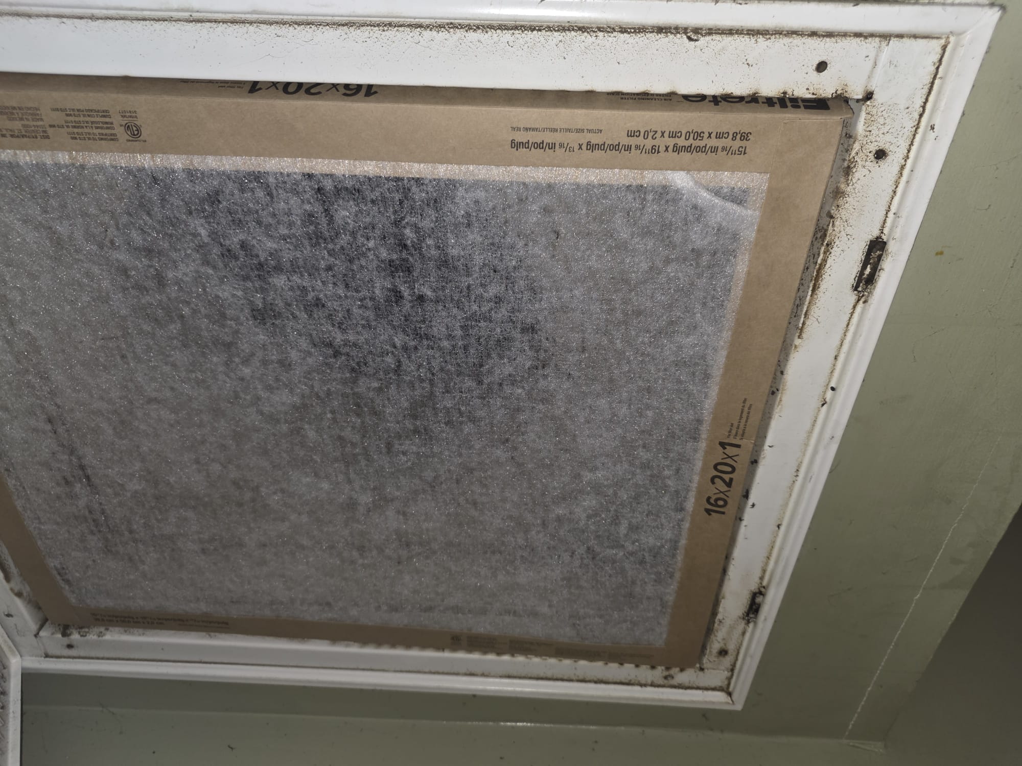 Brand-new Filtrete 16x20x1 HVAC air filter freshly installed in a return air vent.