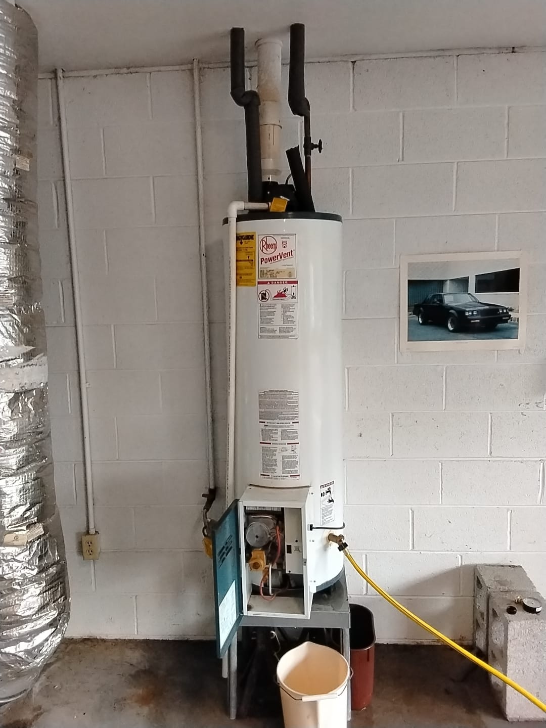 New Rheem PowerVent water heater installed in utility area