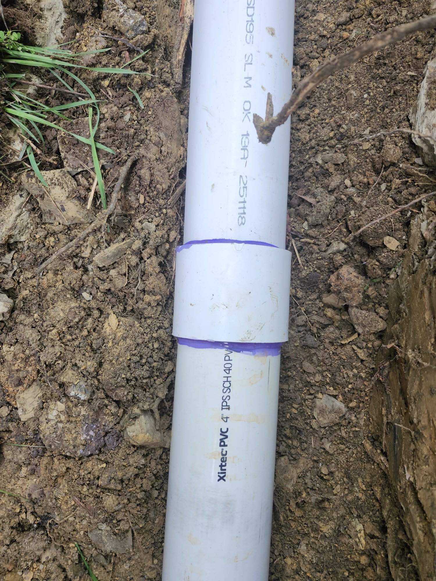 PVC coupling sealed with purple primer