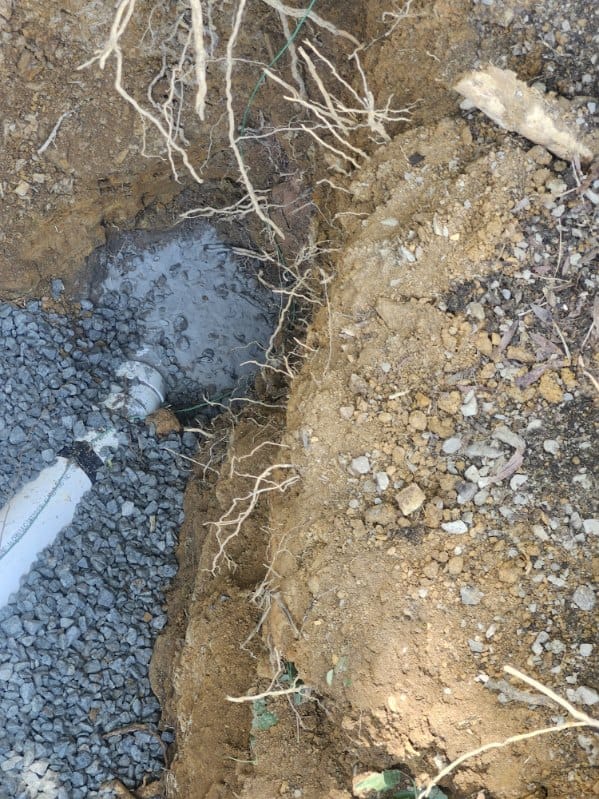 Fresh concrete seal around a new sewer connection