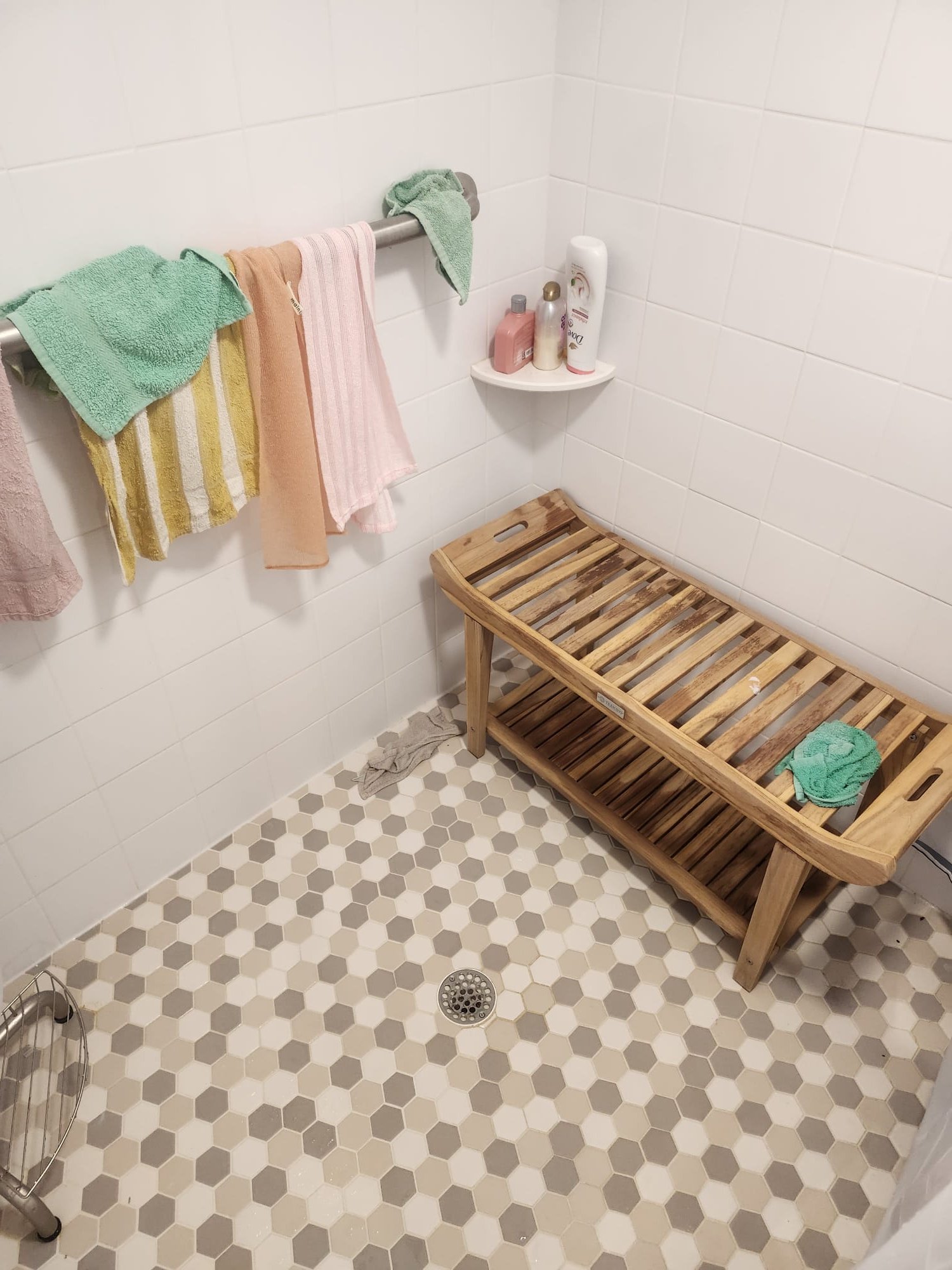 A finished shower drain area that shows a healthy, usable bathroom setup