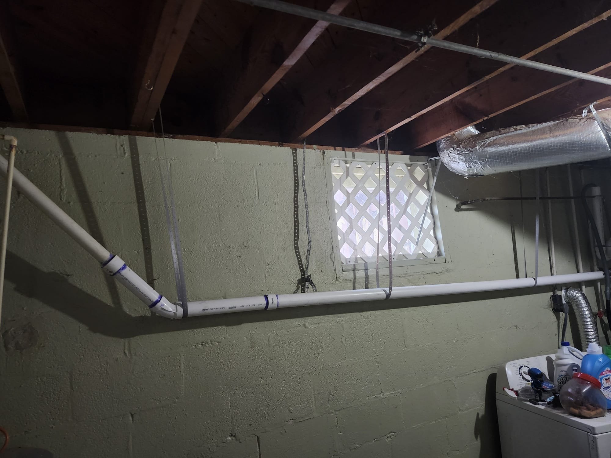 Newly rebuilt basement plumbing with clean PVC connections