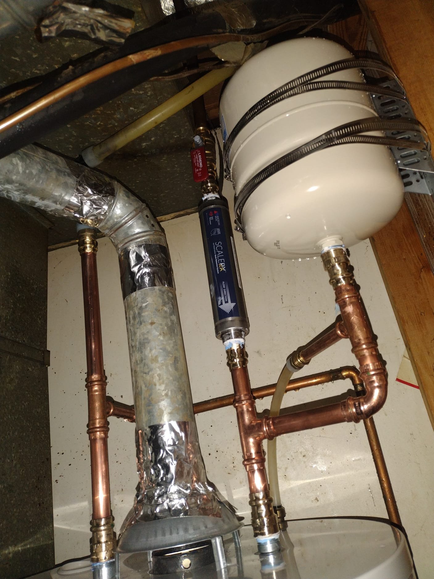 Clean copper piping and shutoff valve at the new water heater