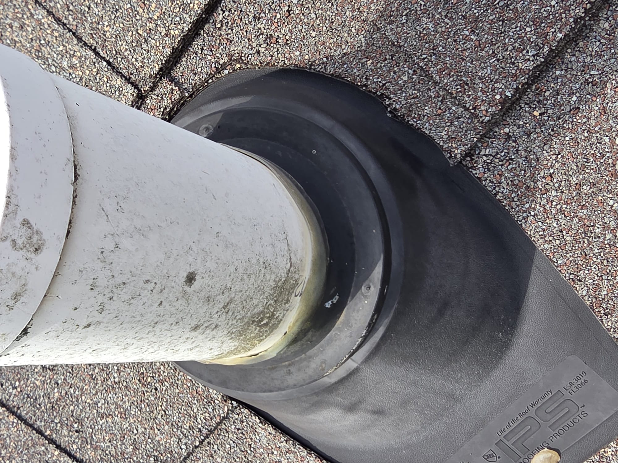 Fresh roof boot detail on an asphalt shingle roof