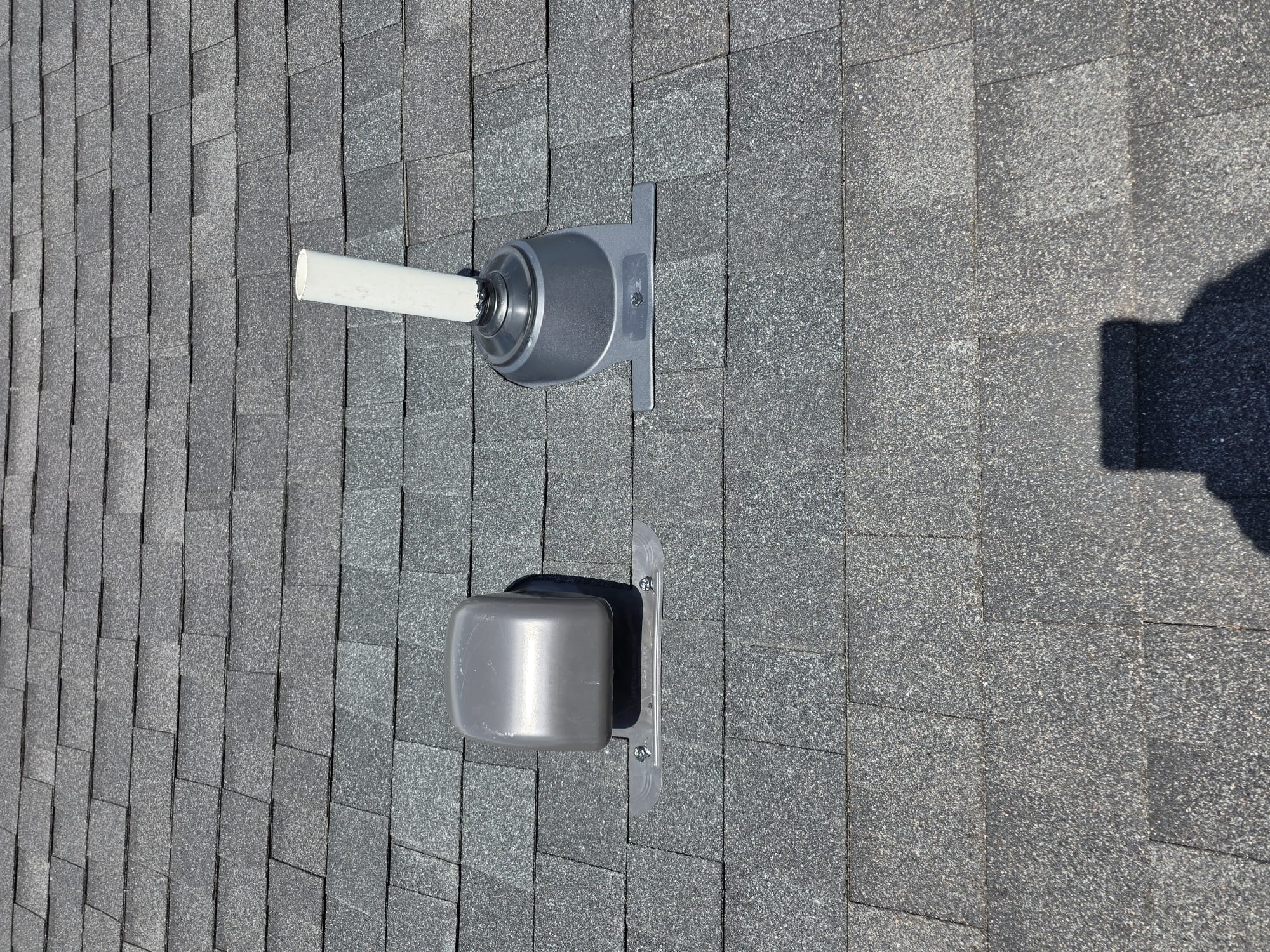 Newly installed roof vent and flashing detail