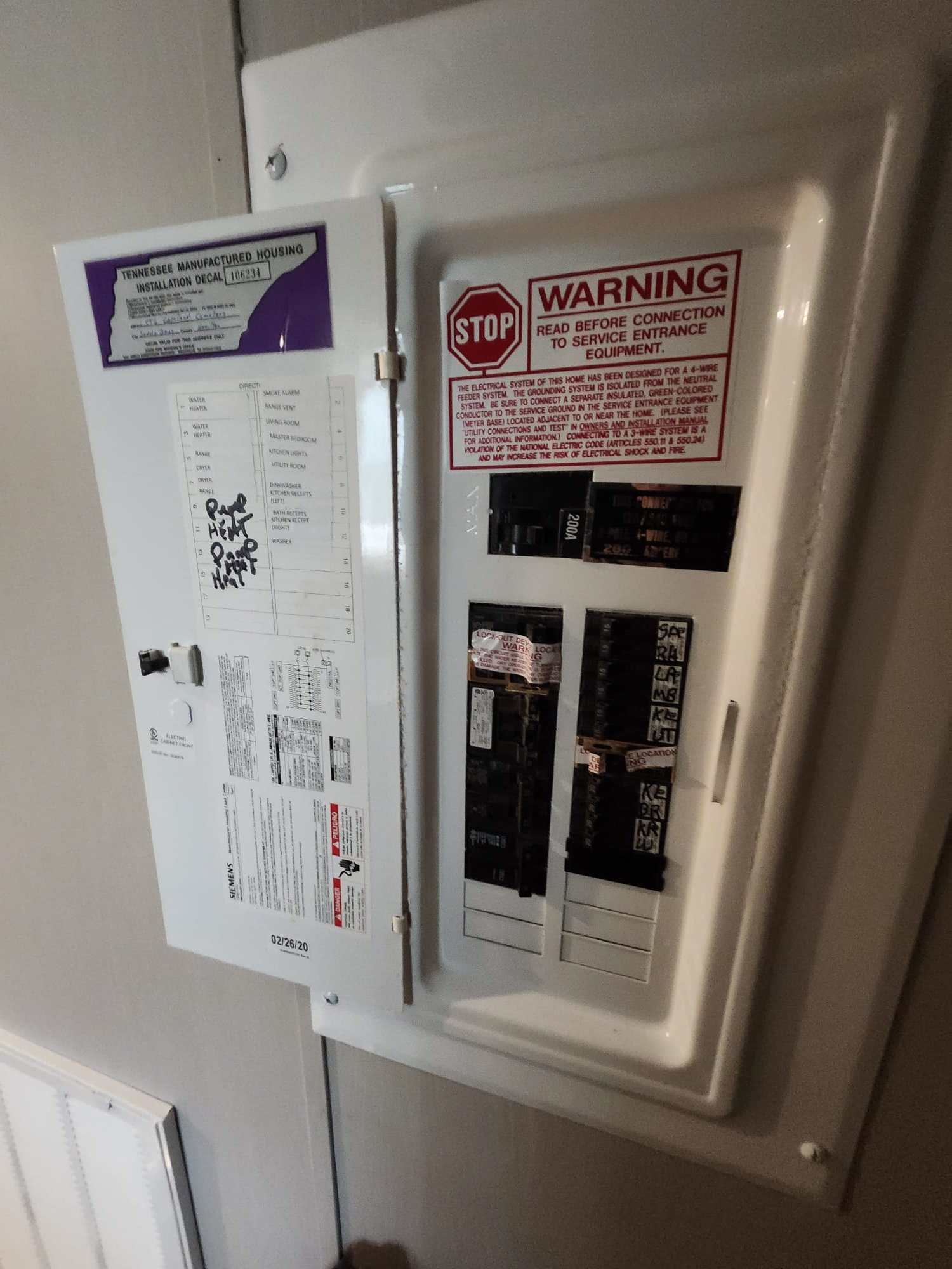 An open home breaker panel with HVAC circuits labeled