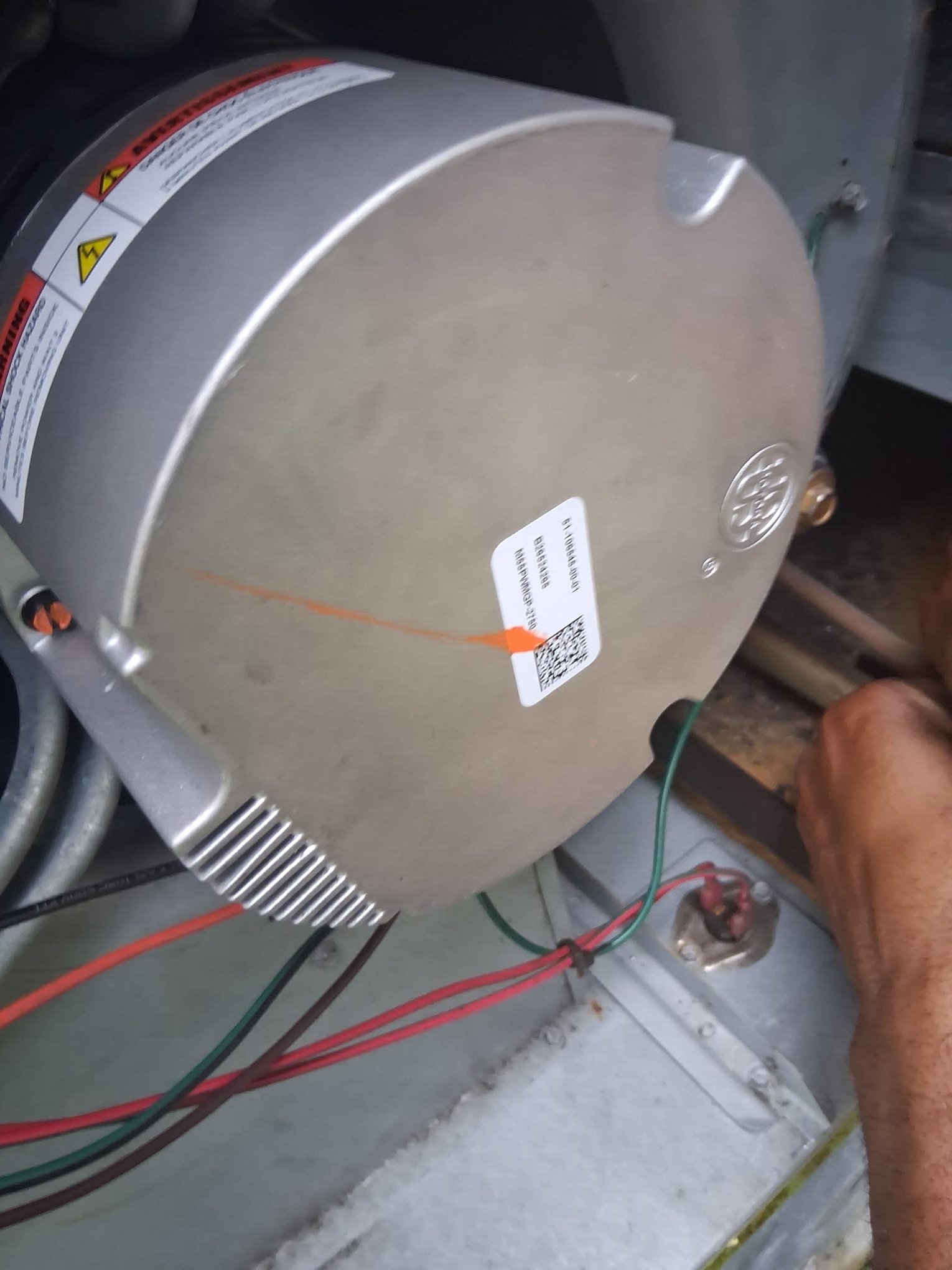 Another view of a replacement blower motor during HVAC service