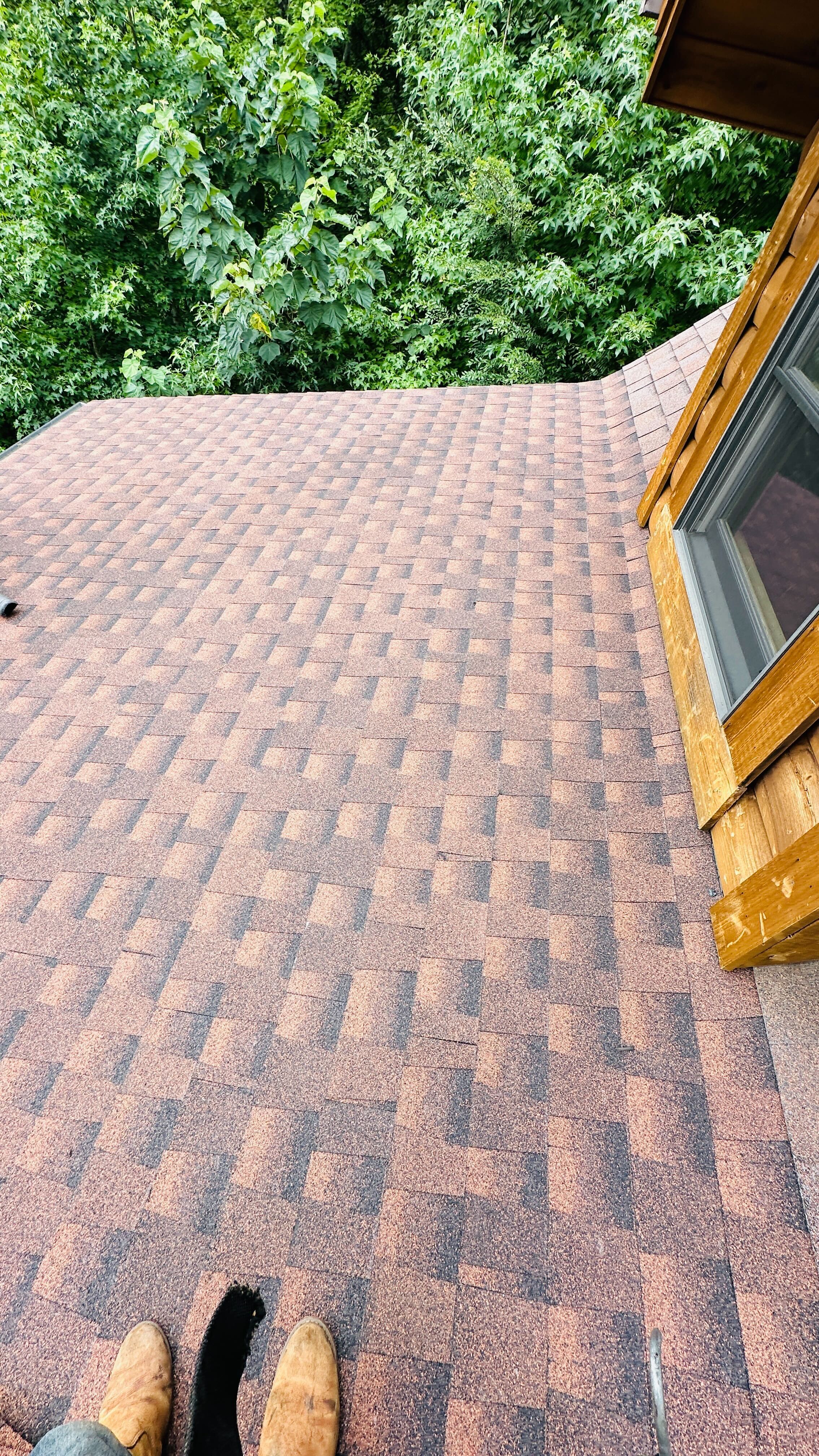 A finished shingle roof after repair work is complete
