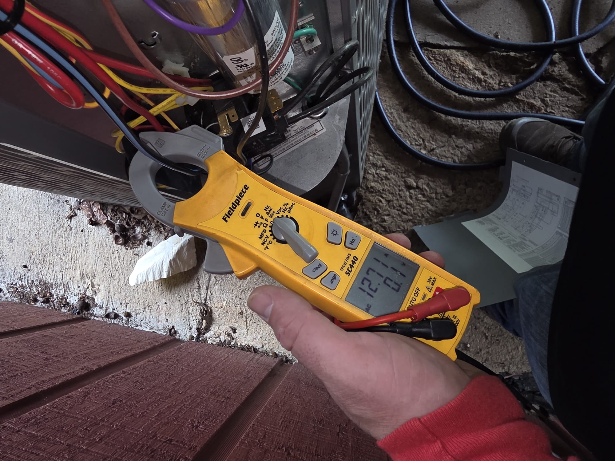 HEP technician testing HVAC electrical components