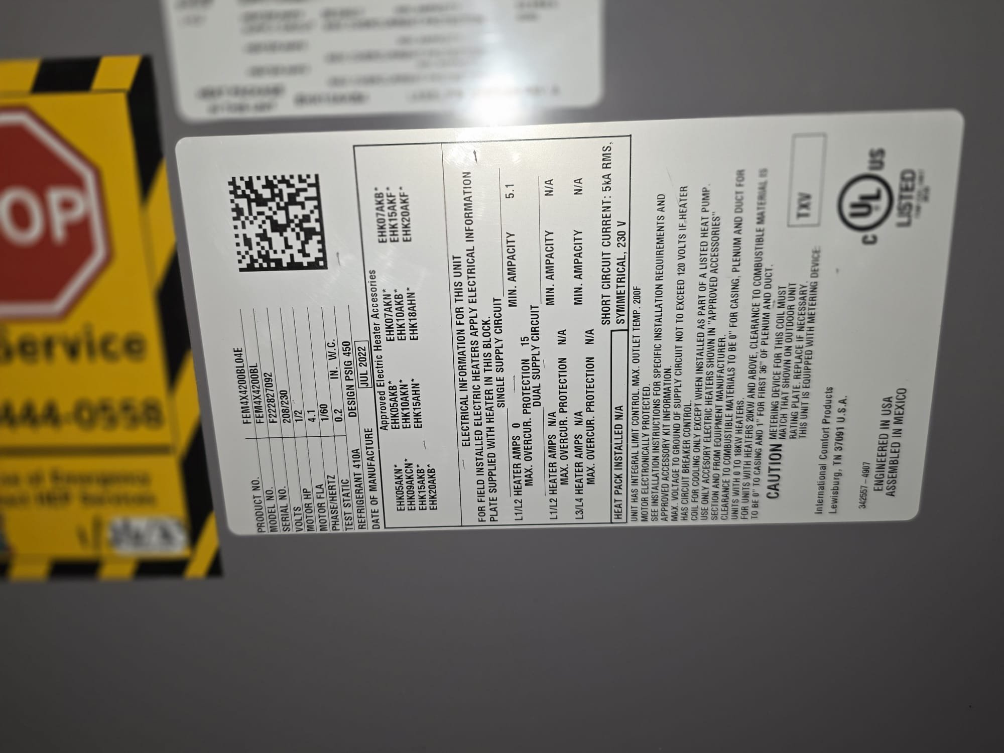 Close-up of a clean HVAC rating label on a newer indoor unit