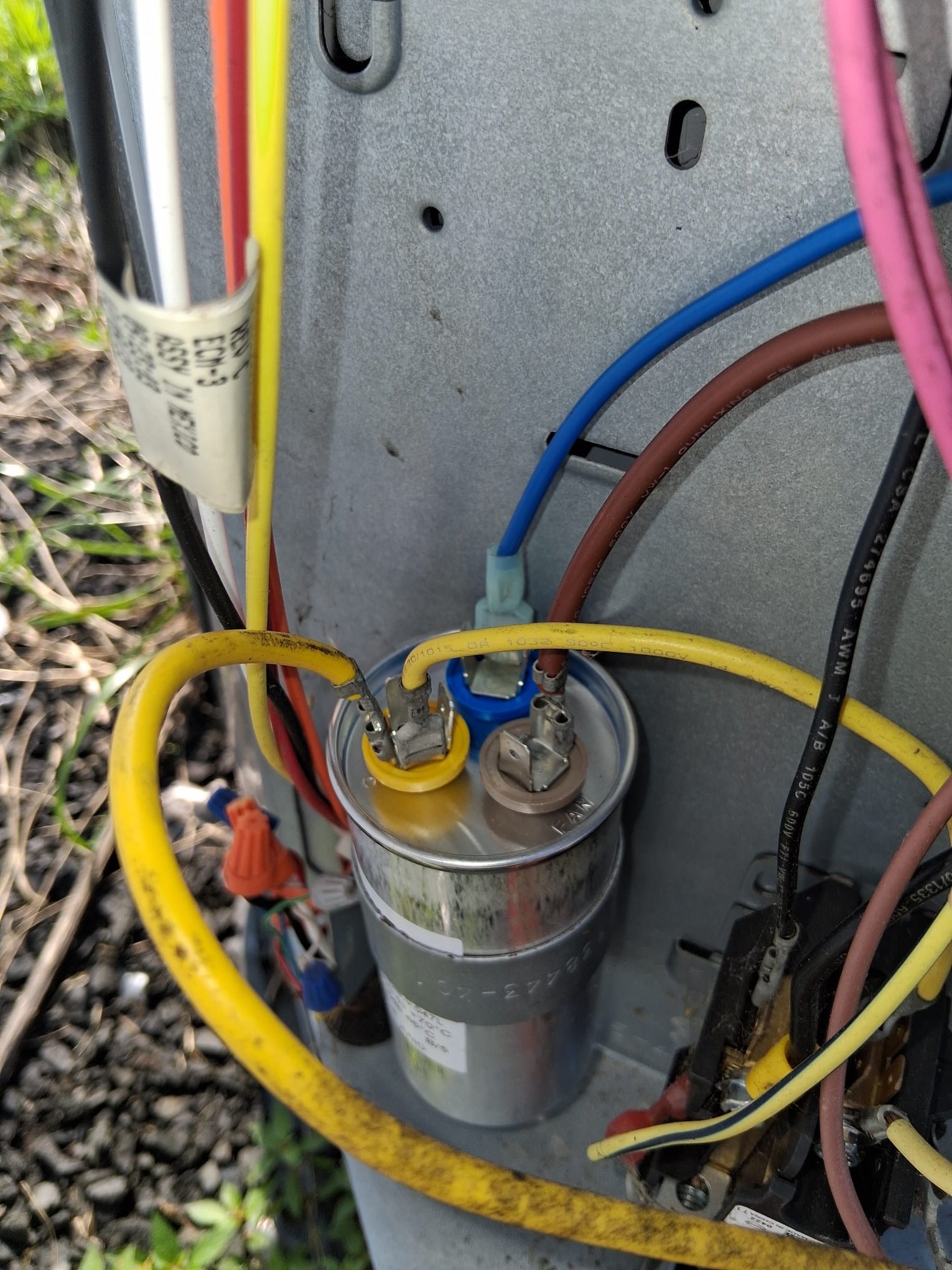 A recently replaced electrical part inside the outdoor unit helps the system start properly again.
