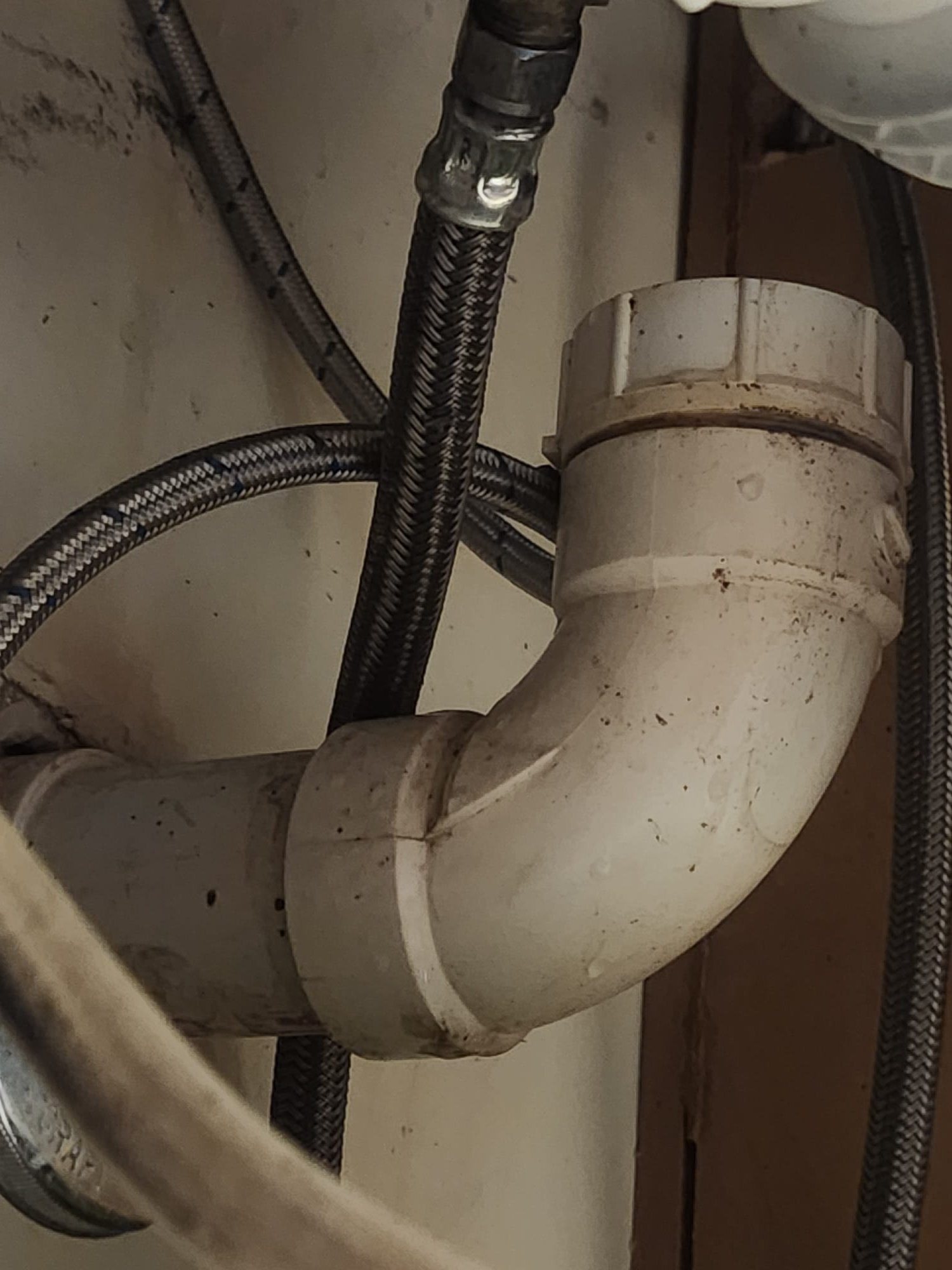 Under-sink drain plumbing and supply lines that should be checked for leaks