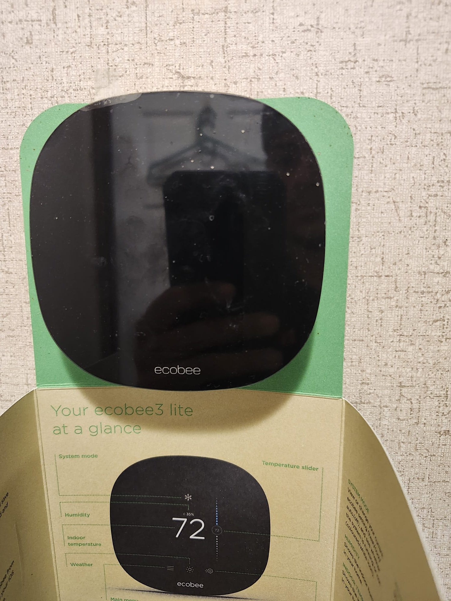New smart thermostat in packaging before installation